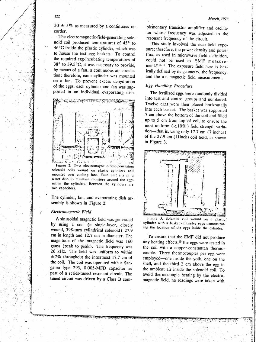 Figure 2. Two electromagnetic-field-generating solenoid coils wound on plastic cylinders and mounted over cooling fans.