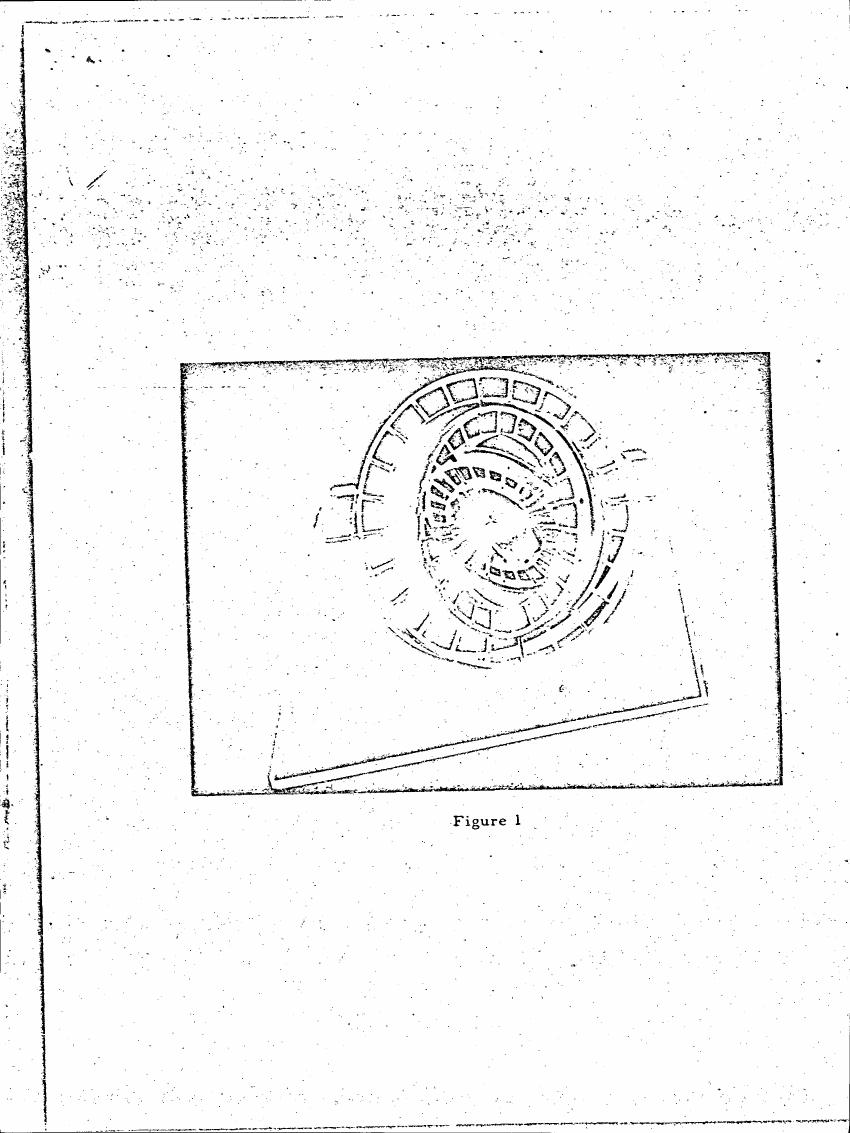 AI-described figure: Figure 1 depicts a circular diagram with concentric rings and squares, possibly representing a conceptual or abstract model.